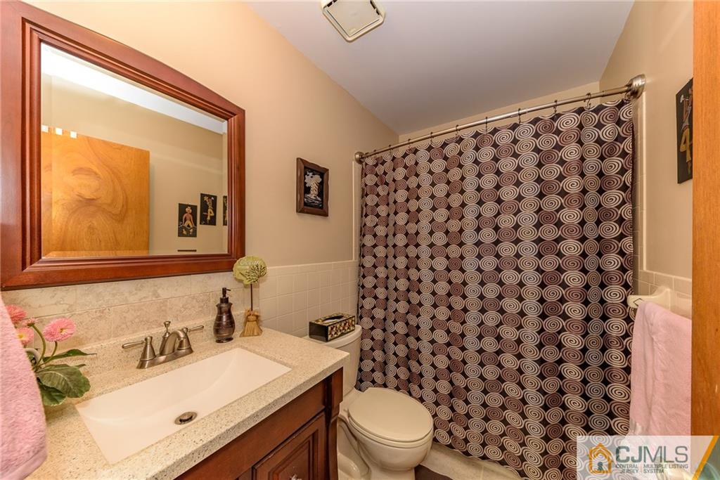 1607 Raspberry Court, Unit 1607 Edison, NJ 08817 - Photo 14 of 14 a bathroom with a sink toilet and shower