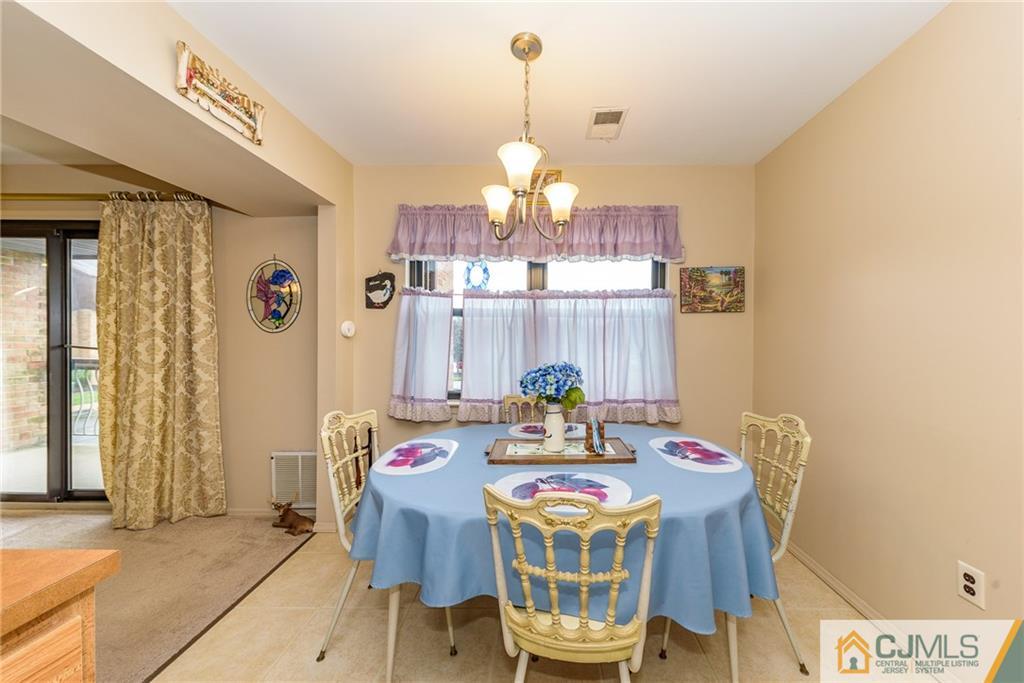 1607 Raspberry Court, Unit 1607 Edison, NJ 08817 - Photo 9 of 14 a view of a dining room with furniture