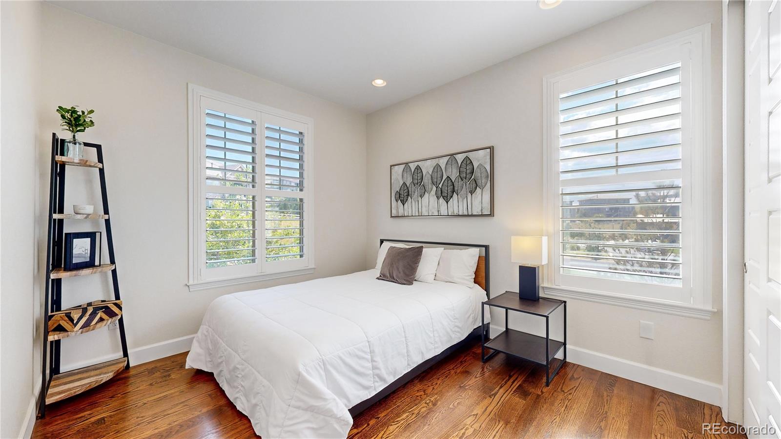 1476 Red Sun Way Highlands Ranch, CO 80126 - Photo 11 of 37 a bedroom with a bed and a window