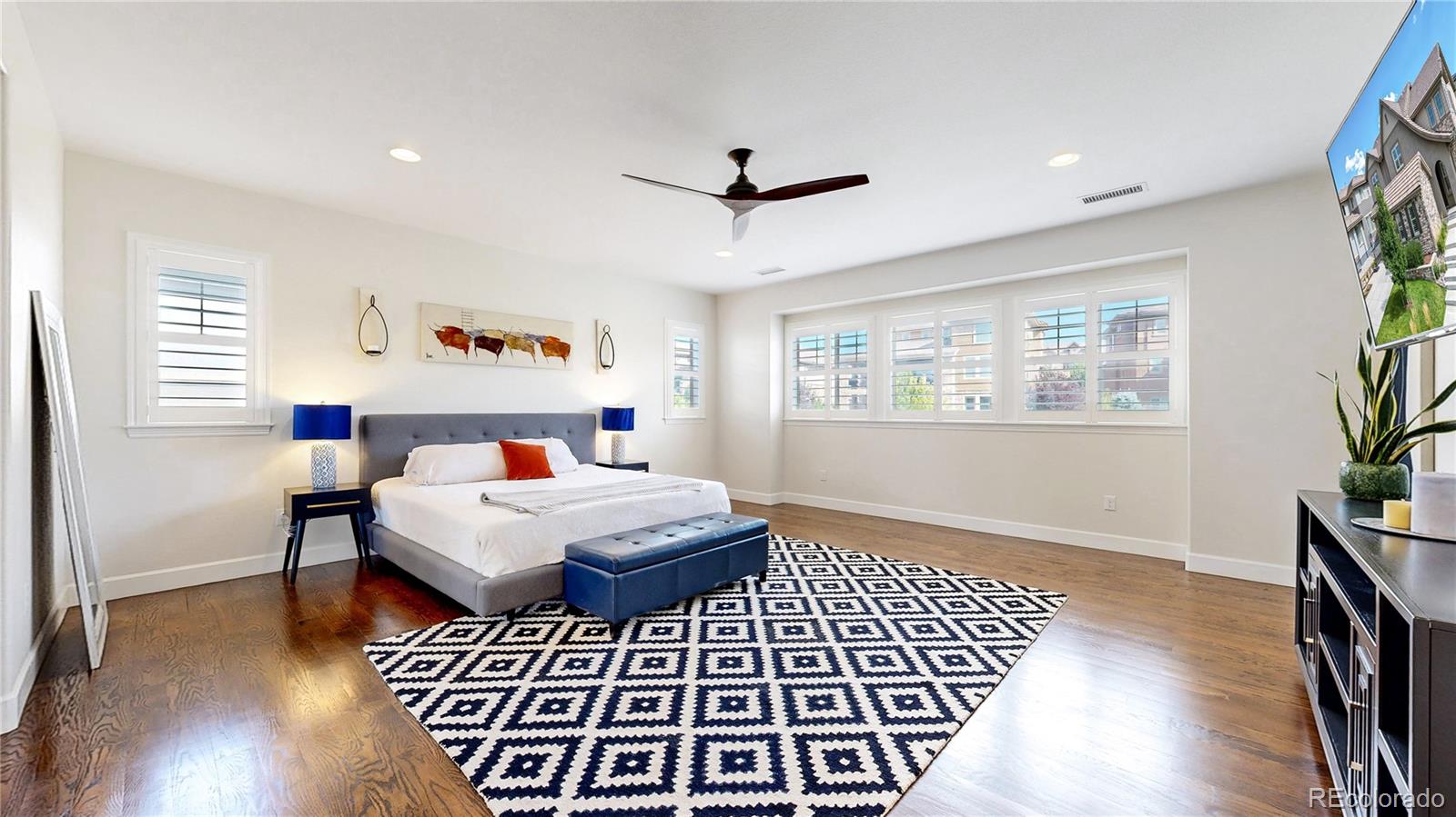 1476 Red Sun Way Highlands Ranch, CO 80126 - Photo 19 of 37 a bedroom with a bed and a window