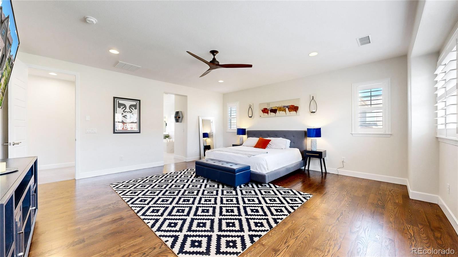 1476 Red Sun Way Highlands Ranch, CO 80126 - Photo 20 of 37 a bedroom with furniture and a window