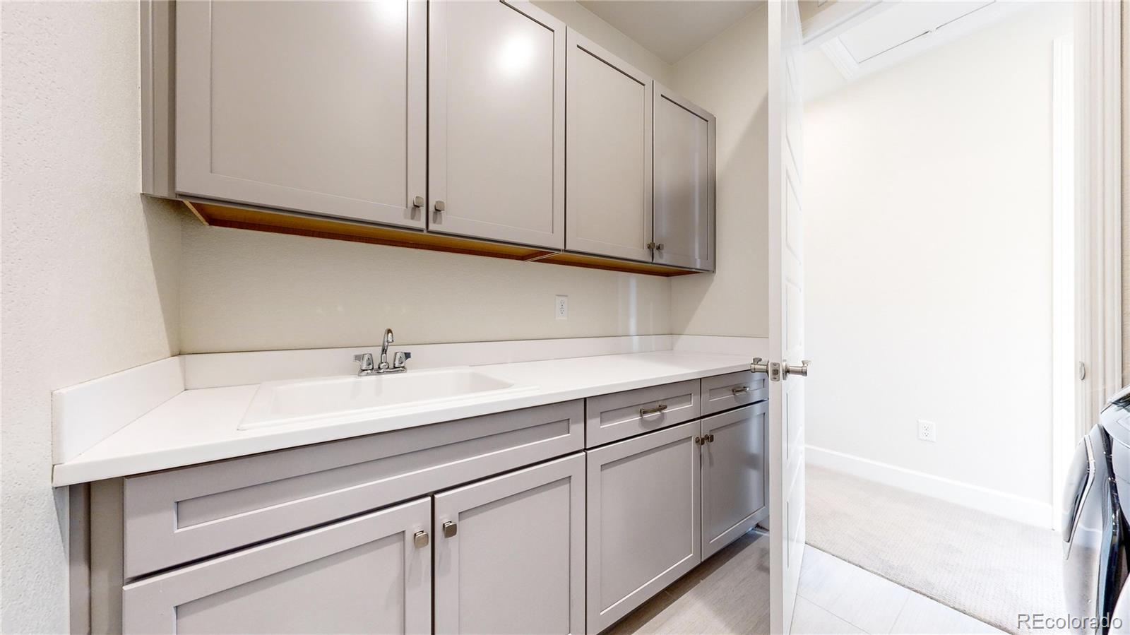 1476 Red Sun Way Highlands Ranch, CO 80126 - Photo 24 of 37 a sink and a mirror