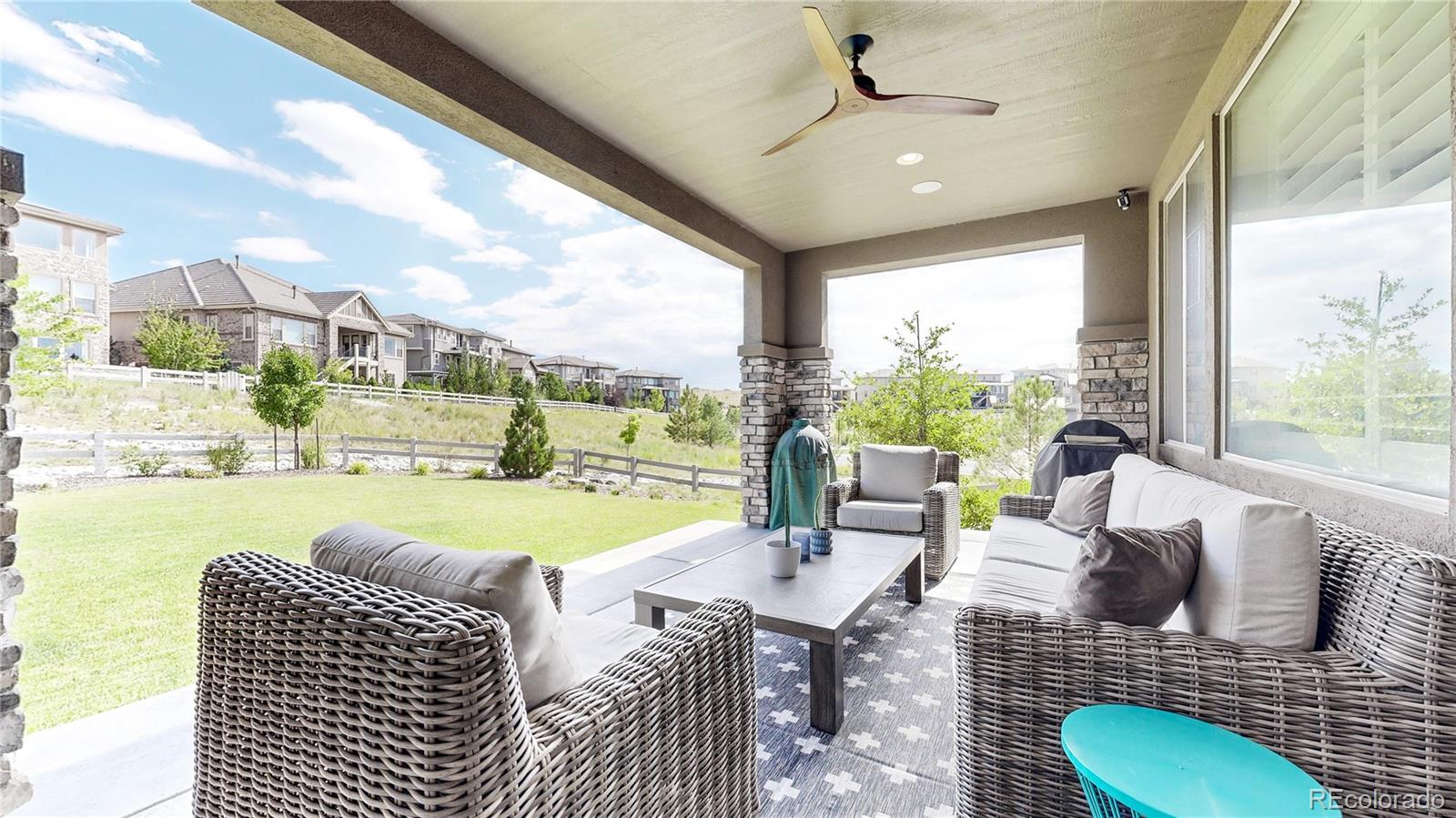 1476 Red Sun Way Highlands Ranch, CO 80126 - Photo 27 of 37 a living room with furniture and a large window