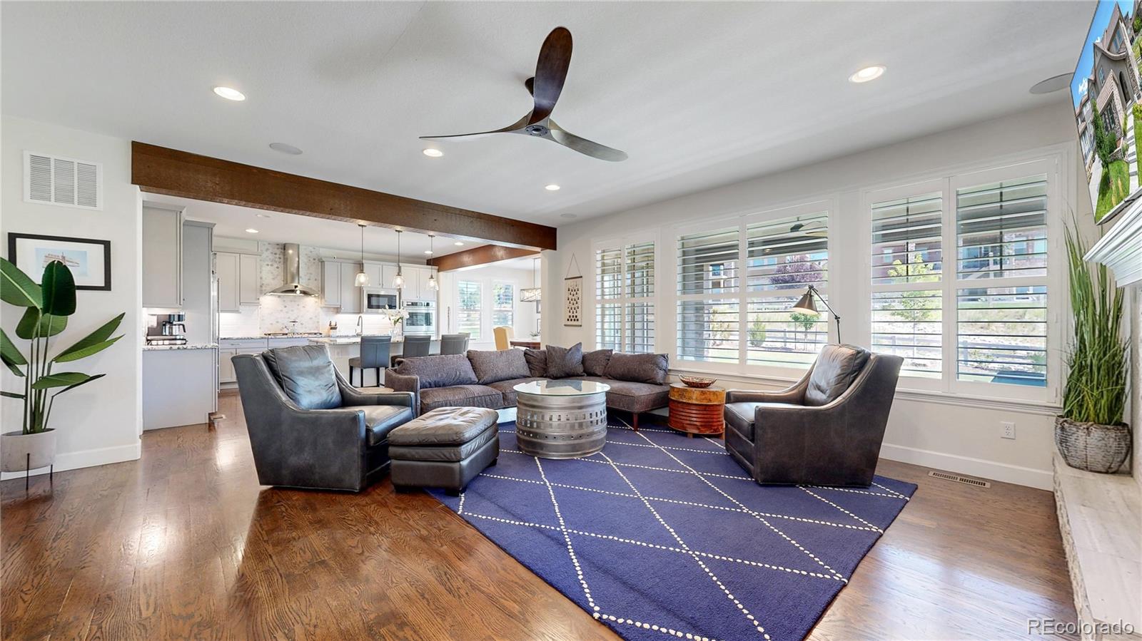 1476 Red Sun Way Highlands Ranch, CO 80126 - Photo 3 of 37 a living room with furniture large window and wooden floor
