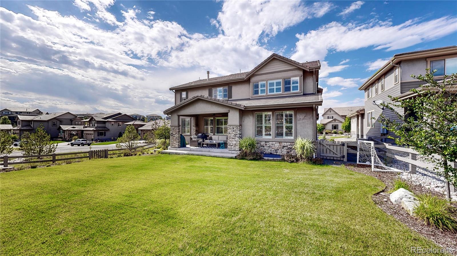 1476 Red Sun Way Highlands Ranch, CO 80126 - Photo 31 of 37 a view of a house with swimming pool and sitting area