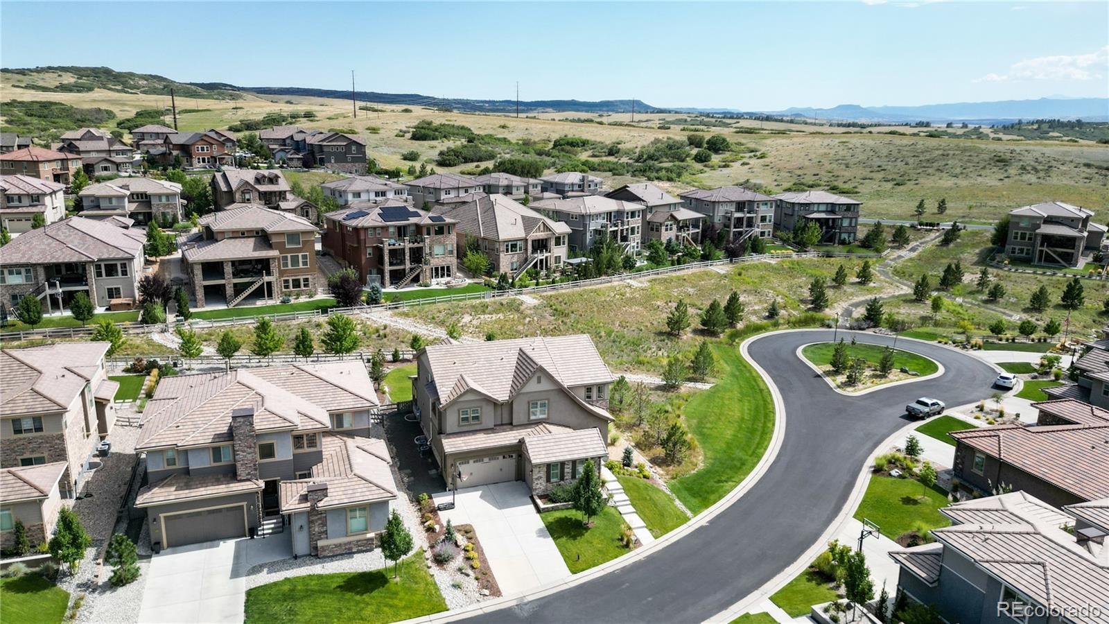 1476 Red Sun Way Highlands Ranch, CO 80126 - Photo 33 of 37 an aerial view of residential houses with outdoor space and ocean view