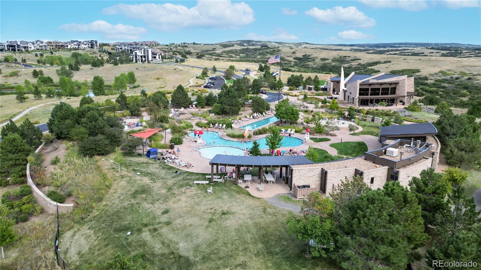 1476 Red Sun Way Highlands Ranch, CO 80126 - Photo 35 of 37 an aerial view of a house with a garden and lake view