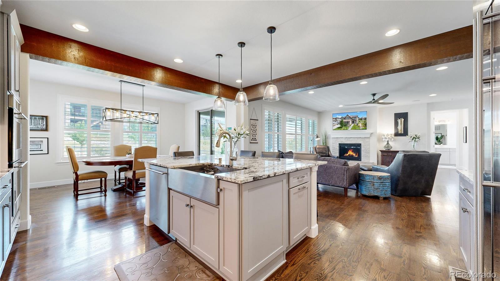 1476 Red Sun Way Highlands Ranch, CO 80126 - Photo 9 of 37 a kitchen with counter top space and wooden floor