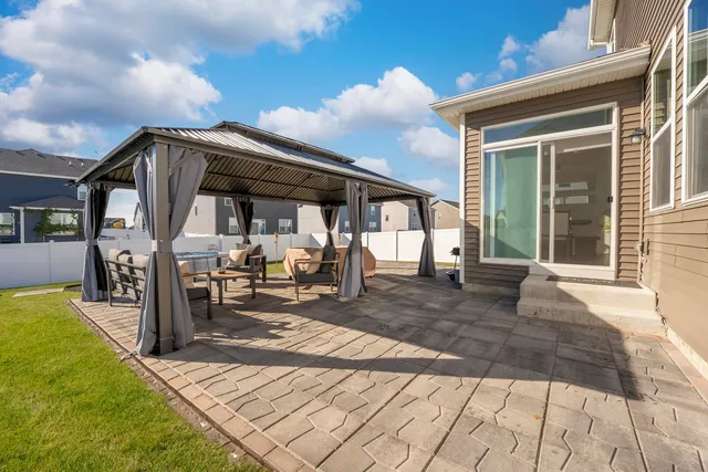 a large house with a big yard and large trees