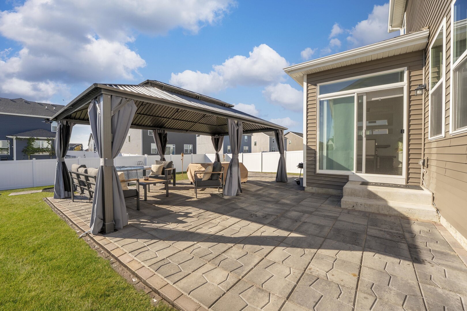 2017 Lilyana Lane Plainfield, IL 60586 - Photo 12 of 43 a view of a house with backyard porch and sitting area