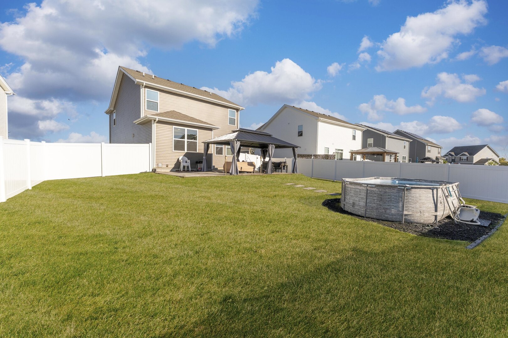 2017 Lilyana Lane Plainfield, IL 60586 - Photo 13 of 43 a large house with a big yard and large trees