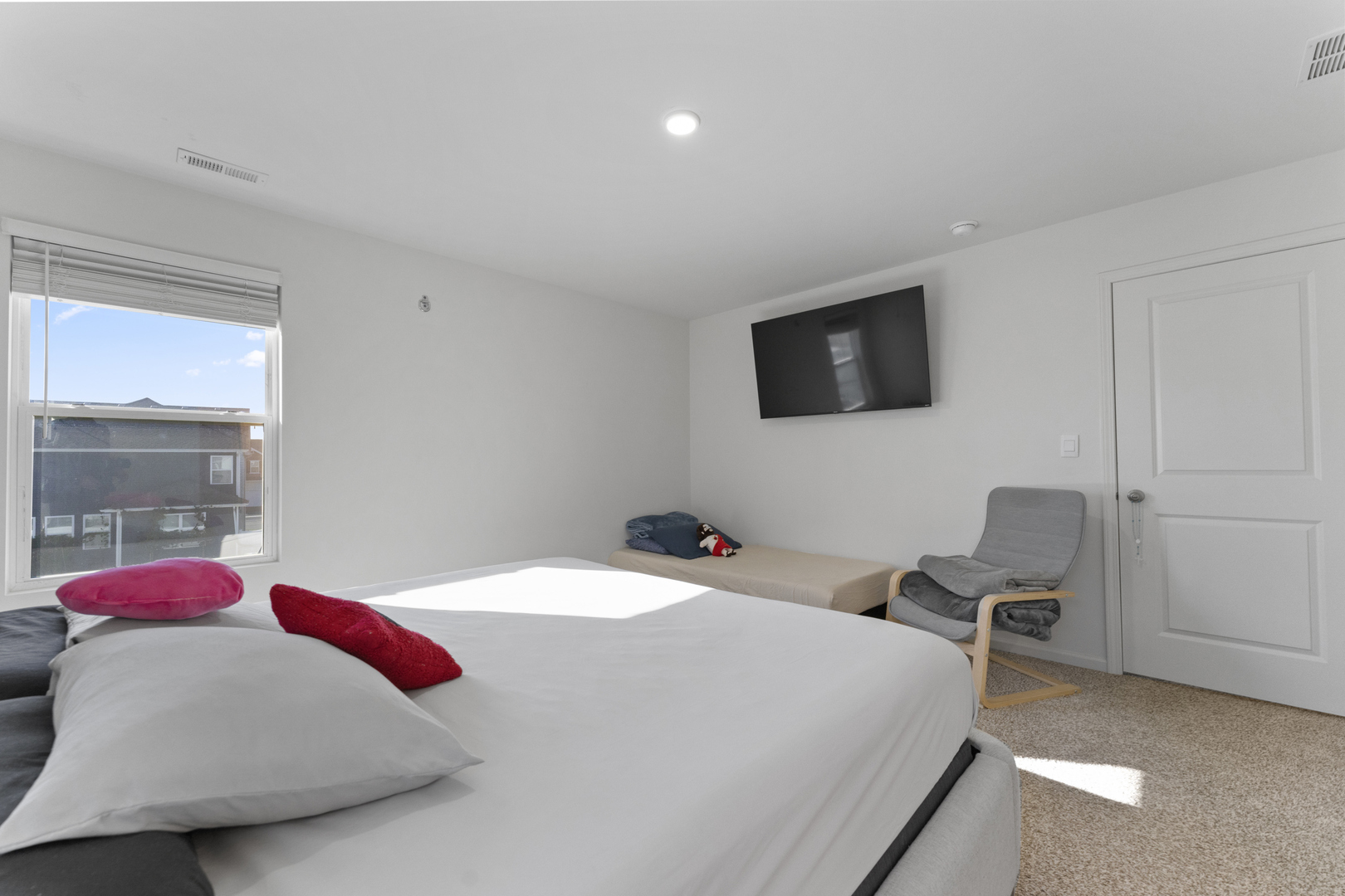 2017 Lilyana Lane Plainfield, IL 60586 - Photo 17 of 43 a bedroom with a bed and flat screen tv