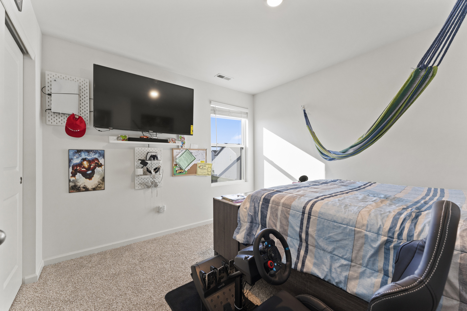 2017 Lilyana Lane Plainfield, IL 60586 - Photo 20 of 43 a bedroom with a bed and flat screen tv