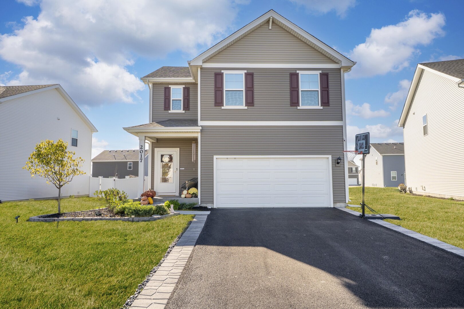 2017 Lilyana Lane Plainfield, IL 60586 - Photo 2 of 43 a front view of a house with a yard and garage