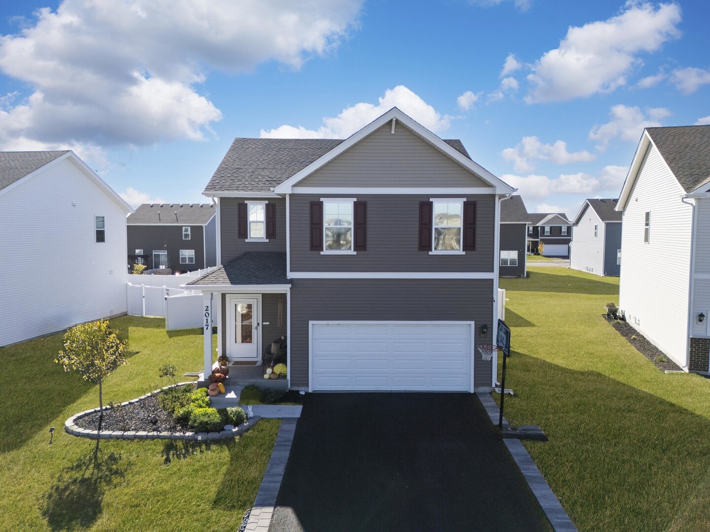 2017 Lilyana Lane Plainfield, IL 60586 - Photo 31 of 43 a front view of a house with garden