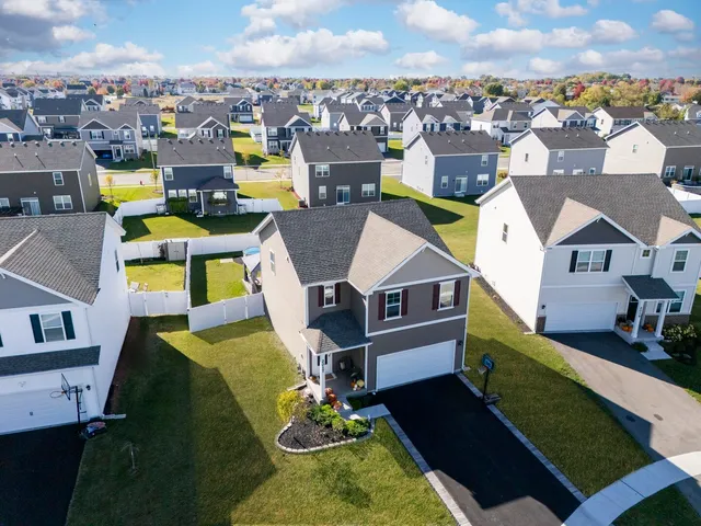 an aerial view of a house with a garden