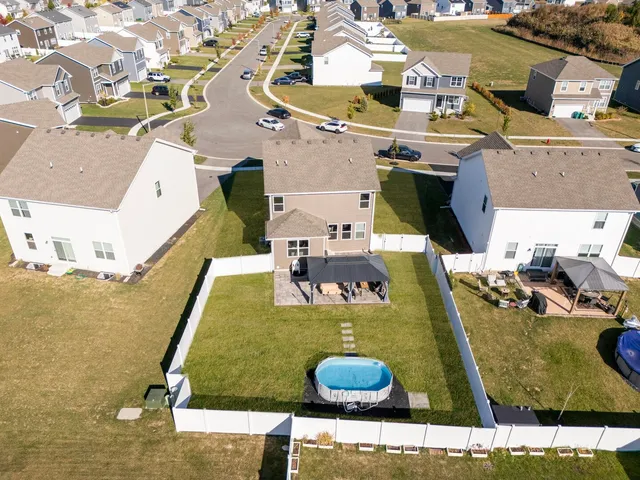 an aerial view of a house with swimming pool