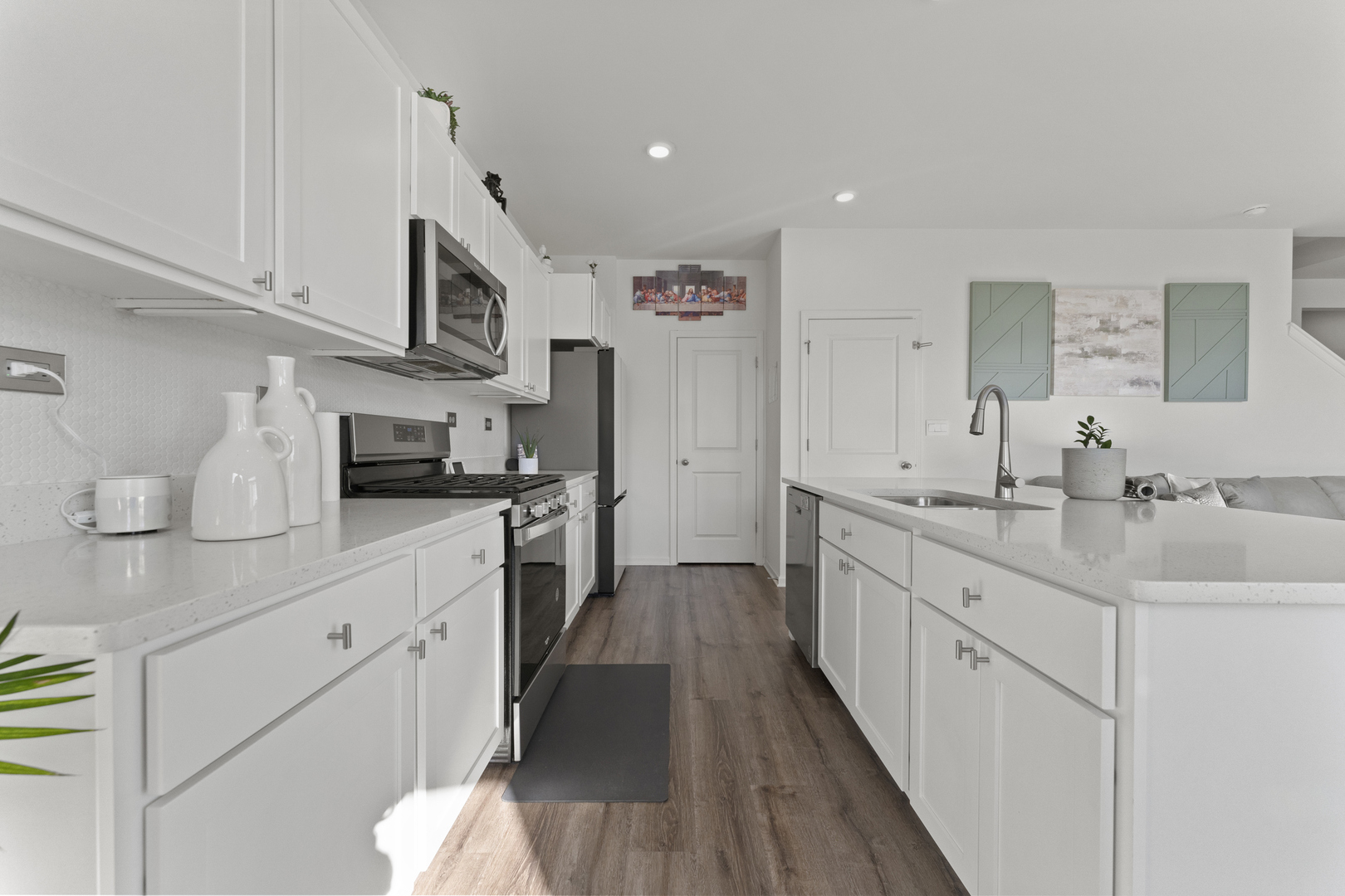 2017 Lilyana Lane Plainfield, IL 60586 - Photo 7 of 43 a kitchen with stainless steel appliances kitchen island granite countertop a sink and cabinets
