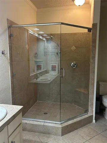 a bathroom with a shower and toilet