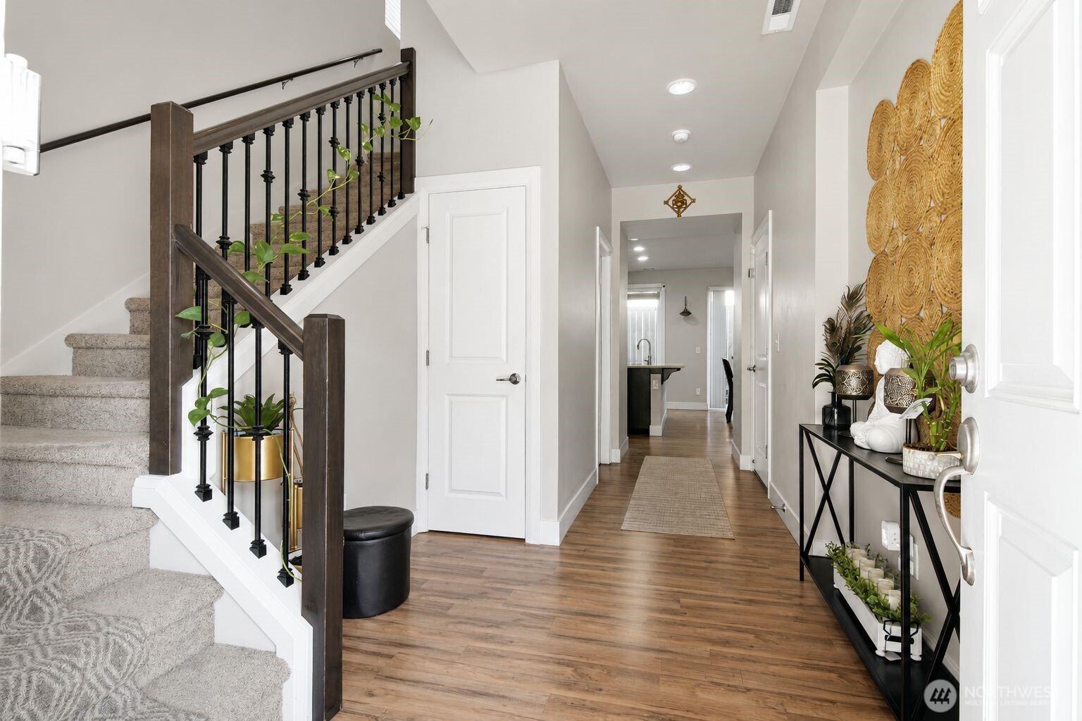 19607 25th Drive Southeast Bothell, WA 98012 - Photo 3 of 30 a view of a hallway with wooden floor and staircase