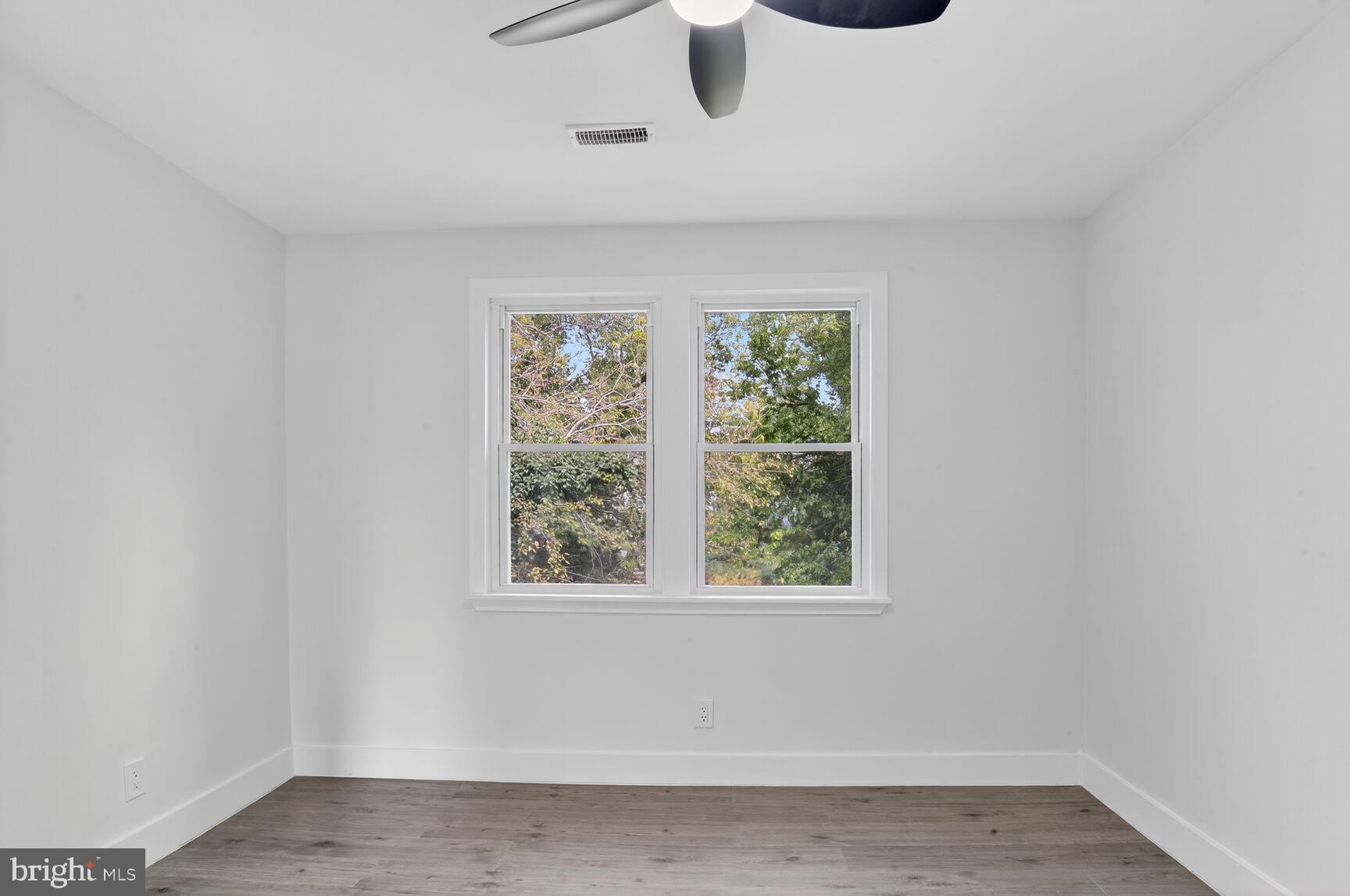 1116 Gleneagle Road, Unit 2 Baltimore, MD 21239 - Photo 10 of 18 an empty room with a window
