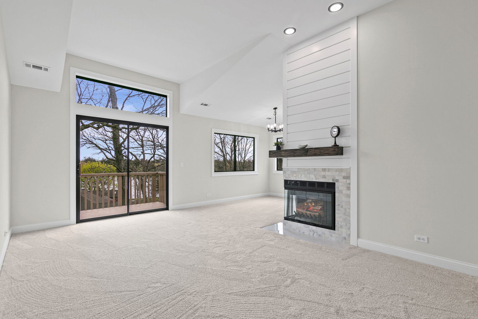 753 Shoreline Road Lake Barrington, IL 60010 - Photo 14 of 21 a view of an empty room with a fireplace and a window