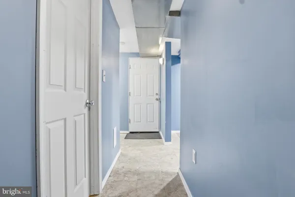 a view of an empty room with a flat screen tv