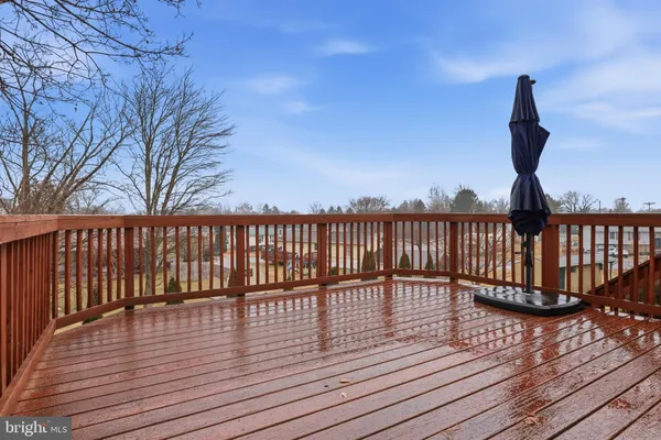 a view of deck with wooden floor and outdoor seating