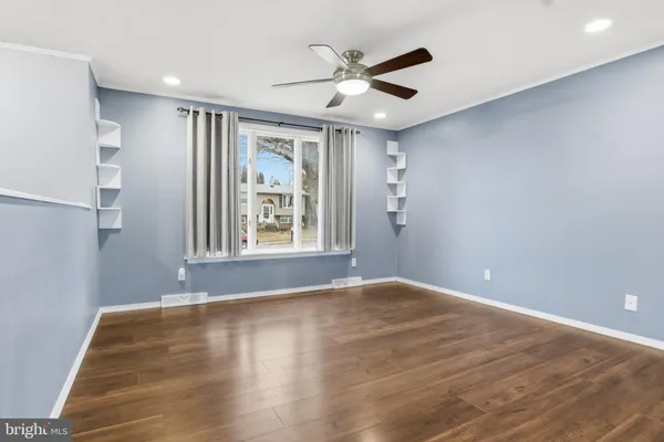 a view of an empty room with a window