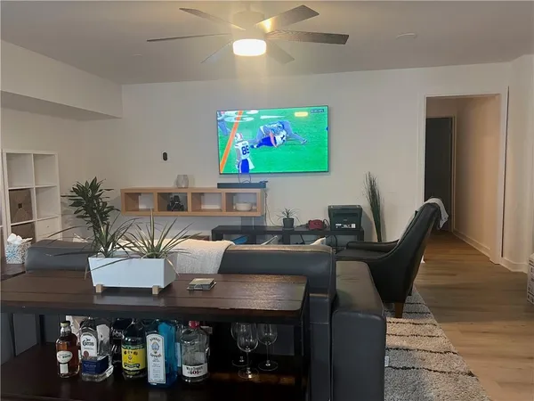 a work room with furniture and wooden floor