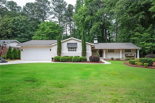 a front view of a house with garden