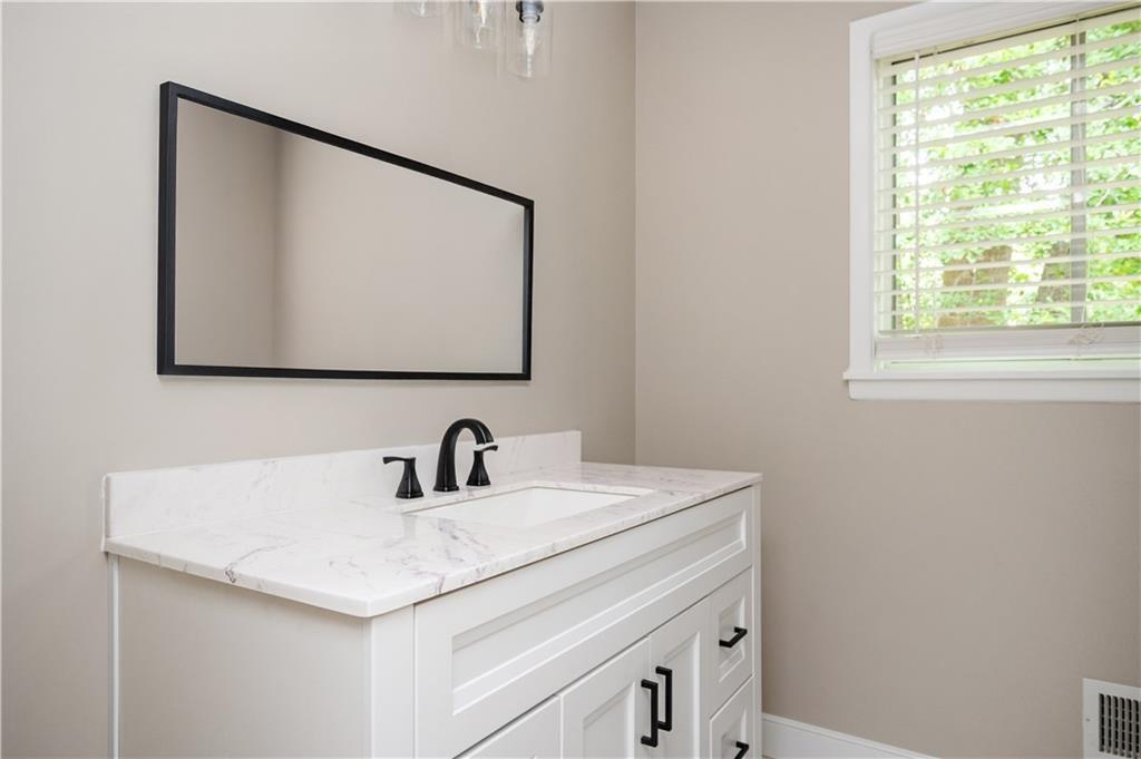3850 Beya Way Atlanta, GA 30340 - Photo 11 of 18 a bathroom with a sink and a mirror