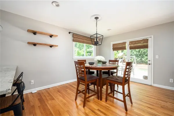 a view of a dining room with furniture window and wooden floor