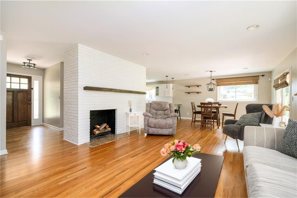 3850 Beya Way Atlanta, GA 30340 - Photo 8 of 18 a living room with furniture fireplace and a table