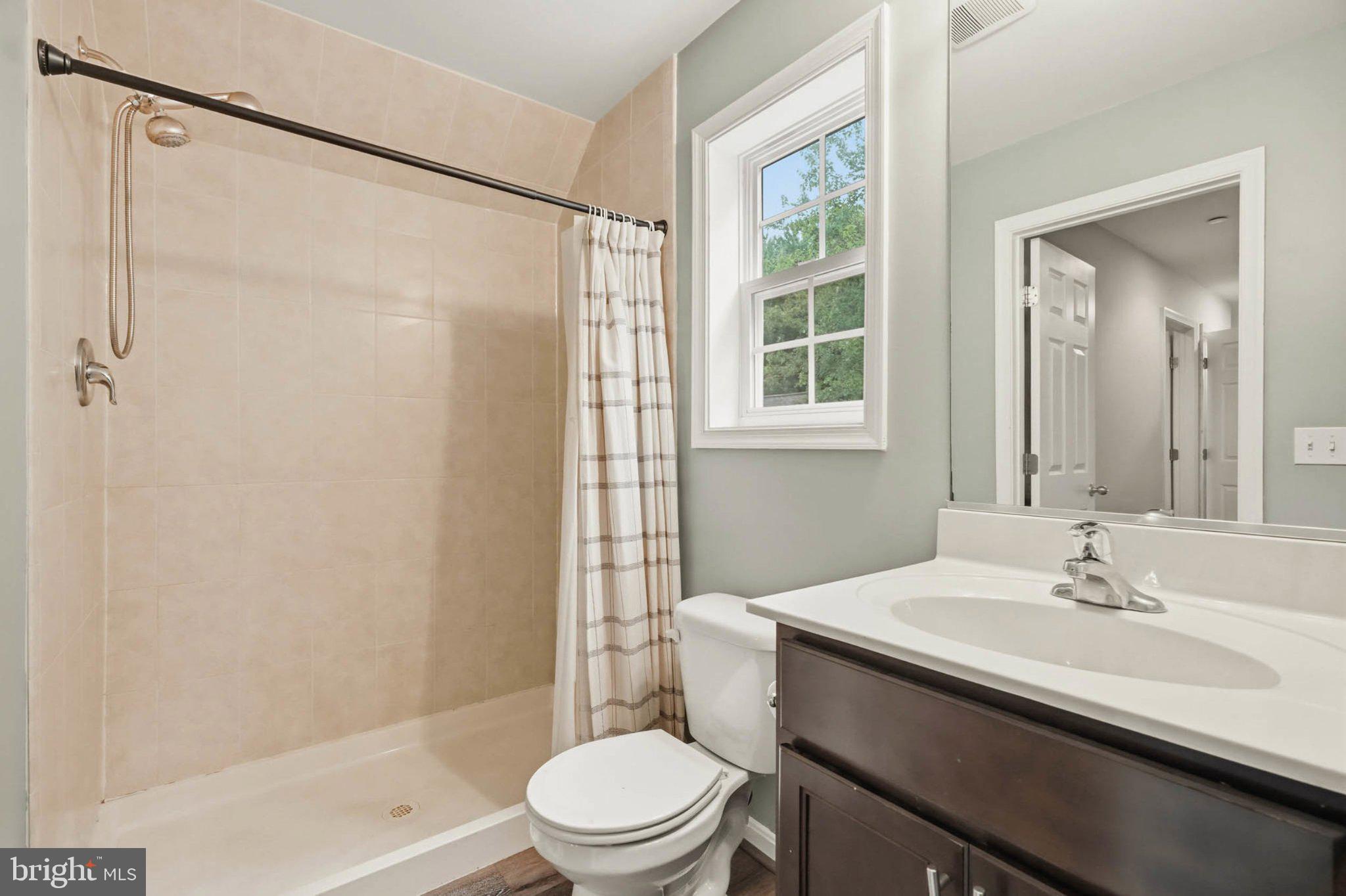 706 Trapper Way Deale, MD 20751 - Photo 44 of 61 Modern bathroom with natural light.