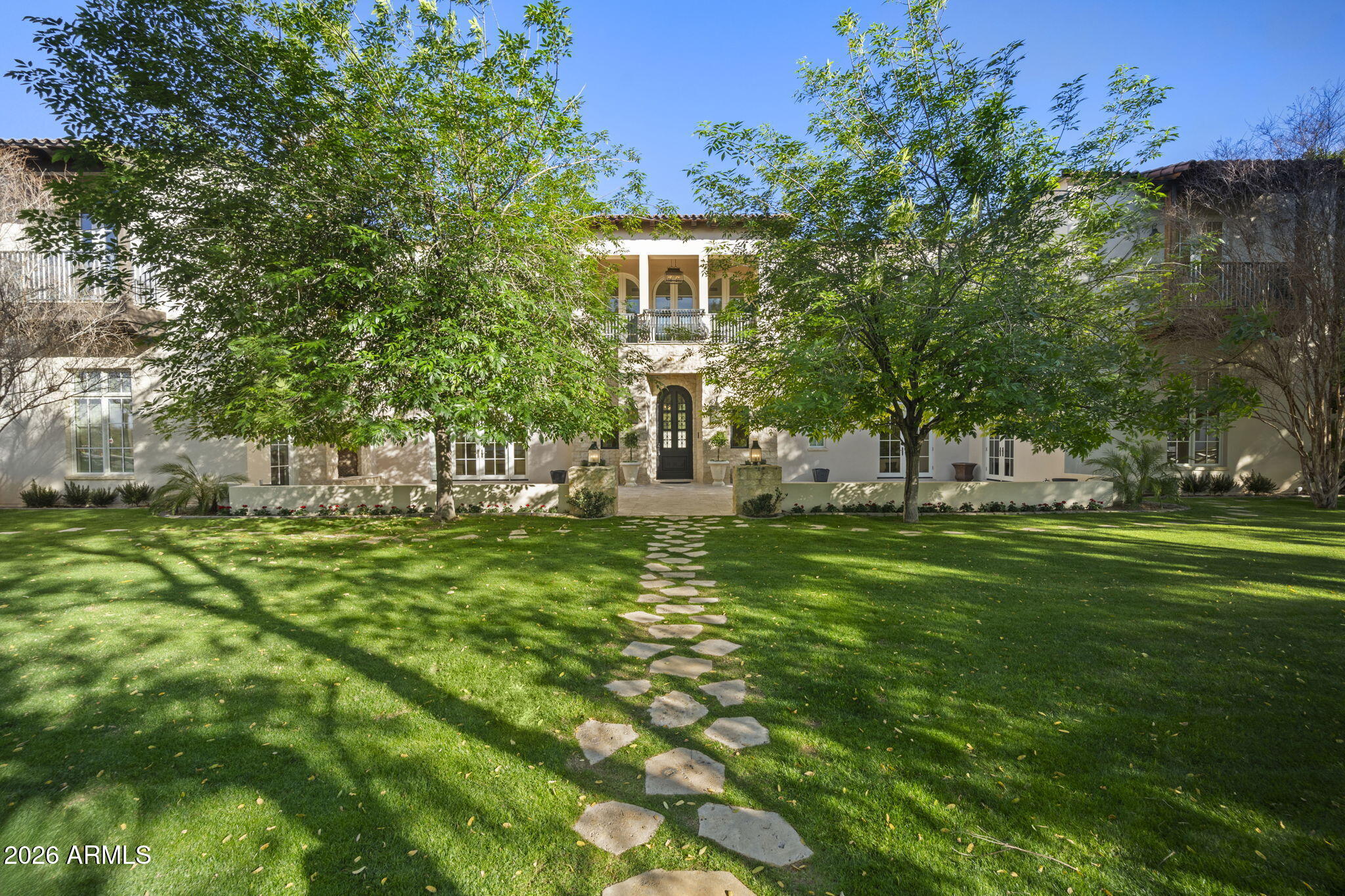 5402 East Exeter Boulevard Phoenix, AZ 85018 - Photo 2 of 110 a front view of a house with a garden