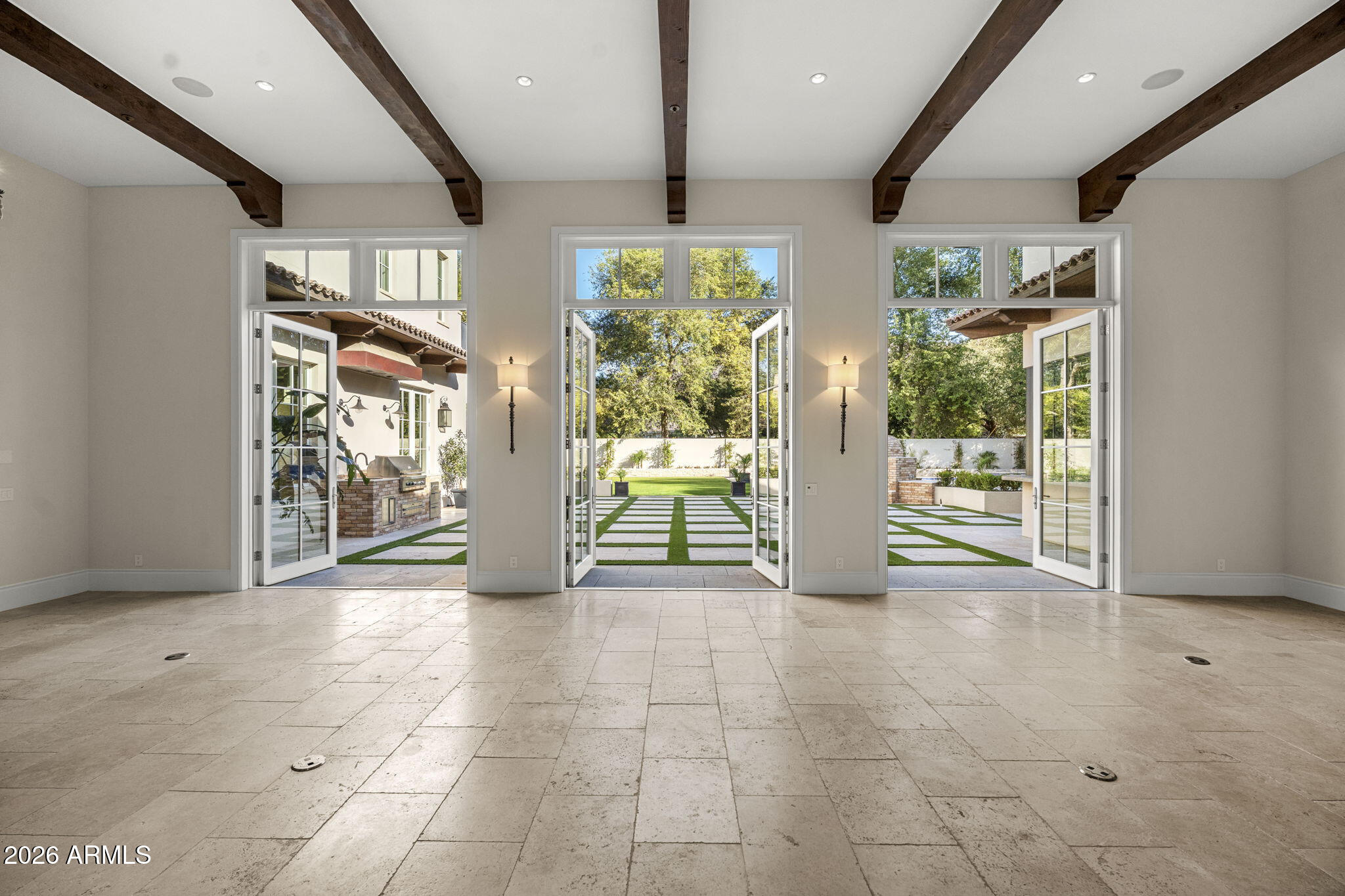 5402 East Exeter Boulevard Phoenix, AZ 85018 - Photo 45 of 110 a view of an entryway with floor to ceiling windows and plants