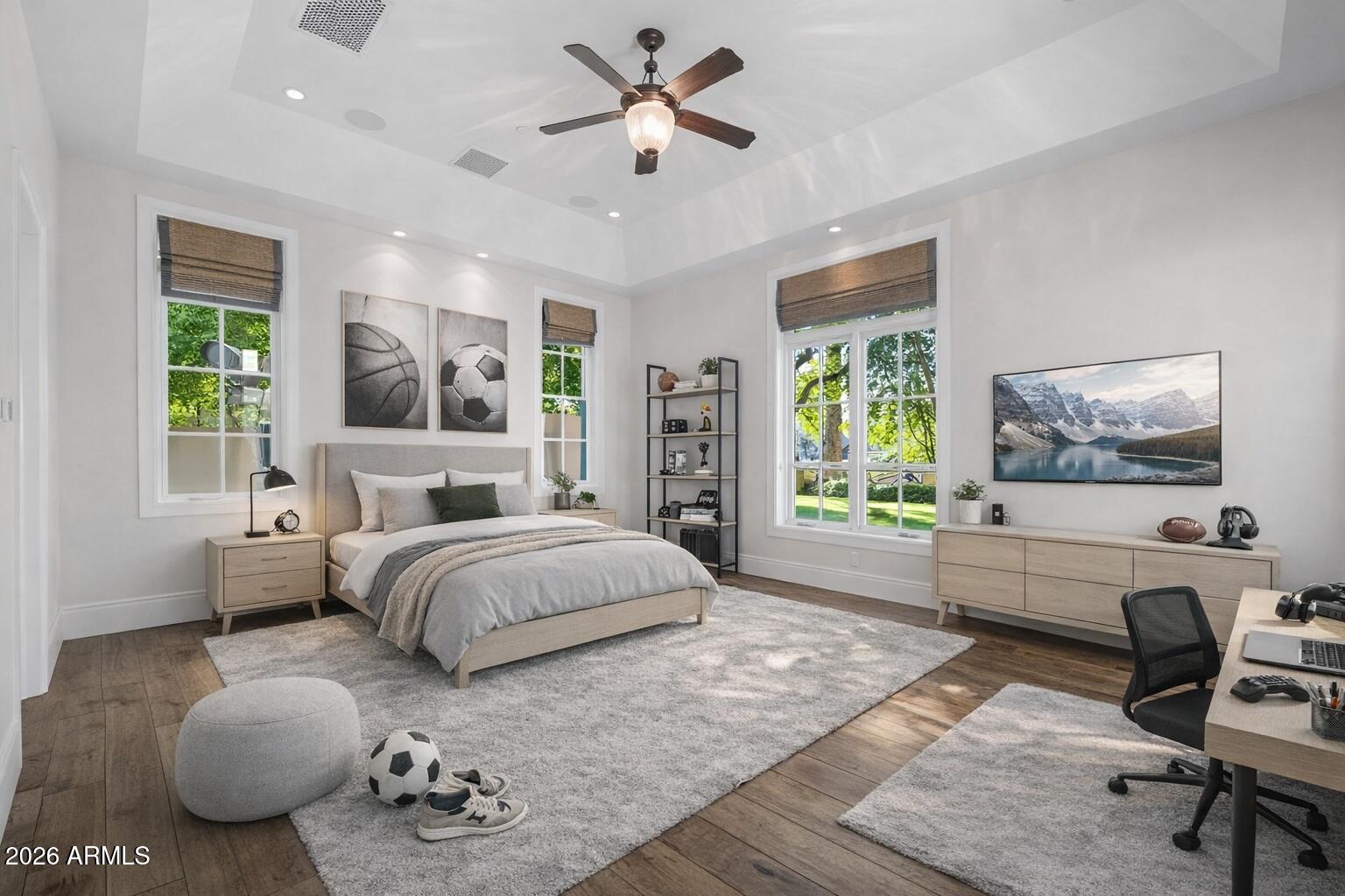 5402 East Exeter Boulevard Phoenix, AZ 85018 - Photo 52 of 110 a spacious bedroom with a large bed and a chandelier