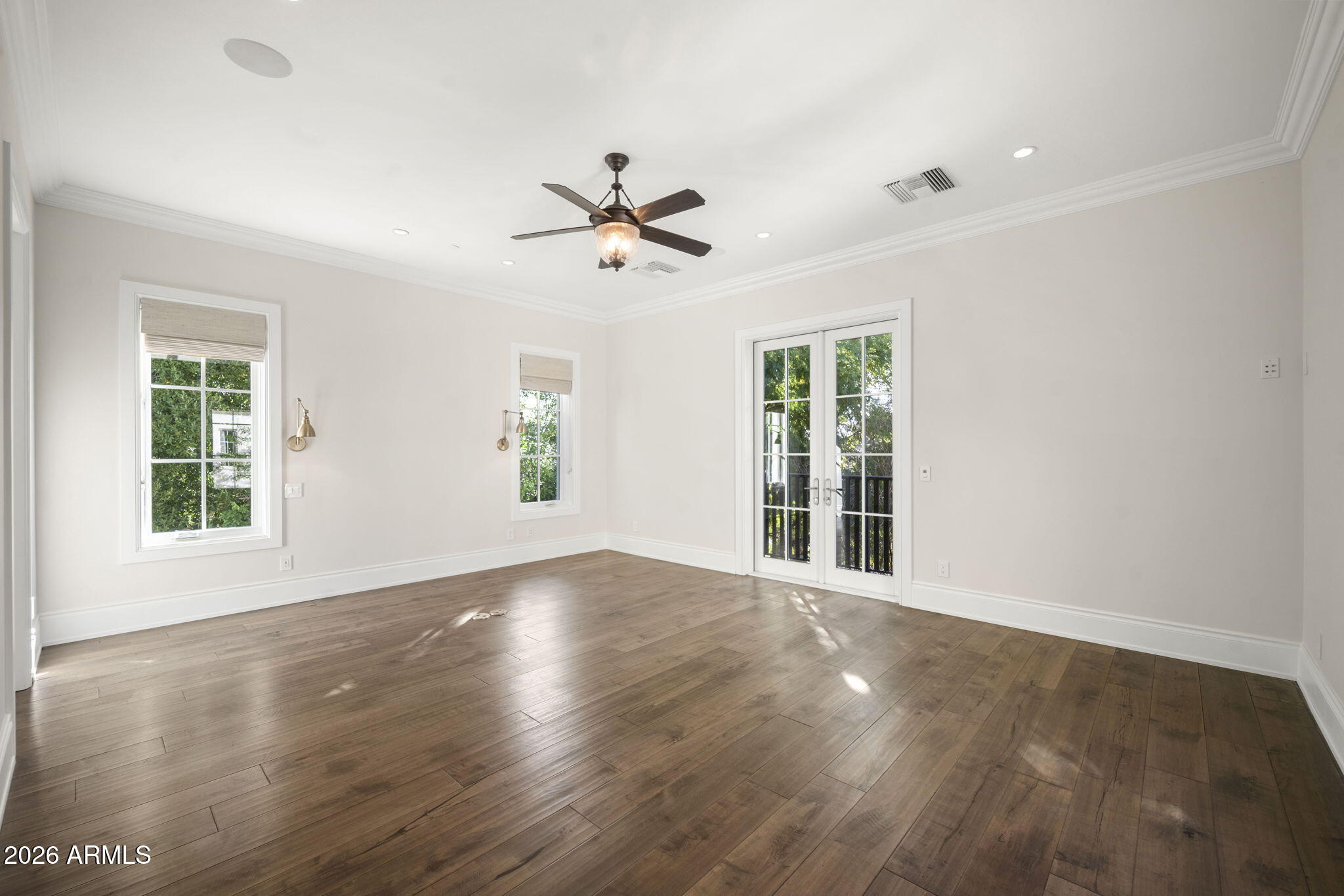 5402 East Exeter Boulevard Phoenix, AZ 85018 - Photo 78 of 111 a view of empty room with wooden floor and fan
