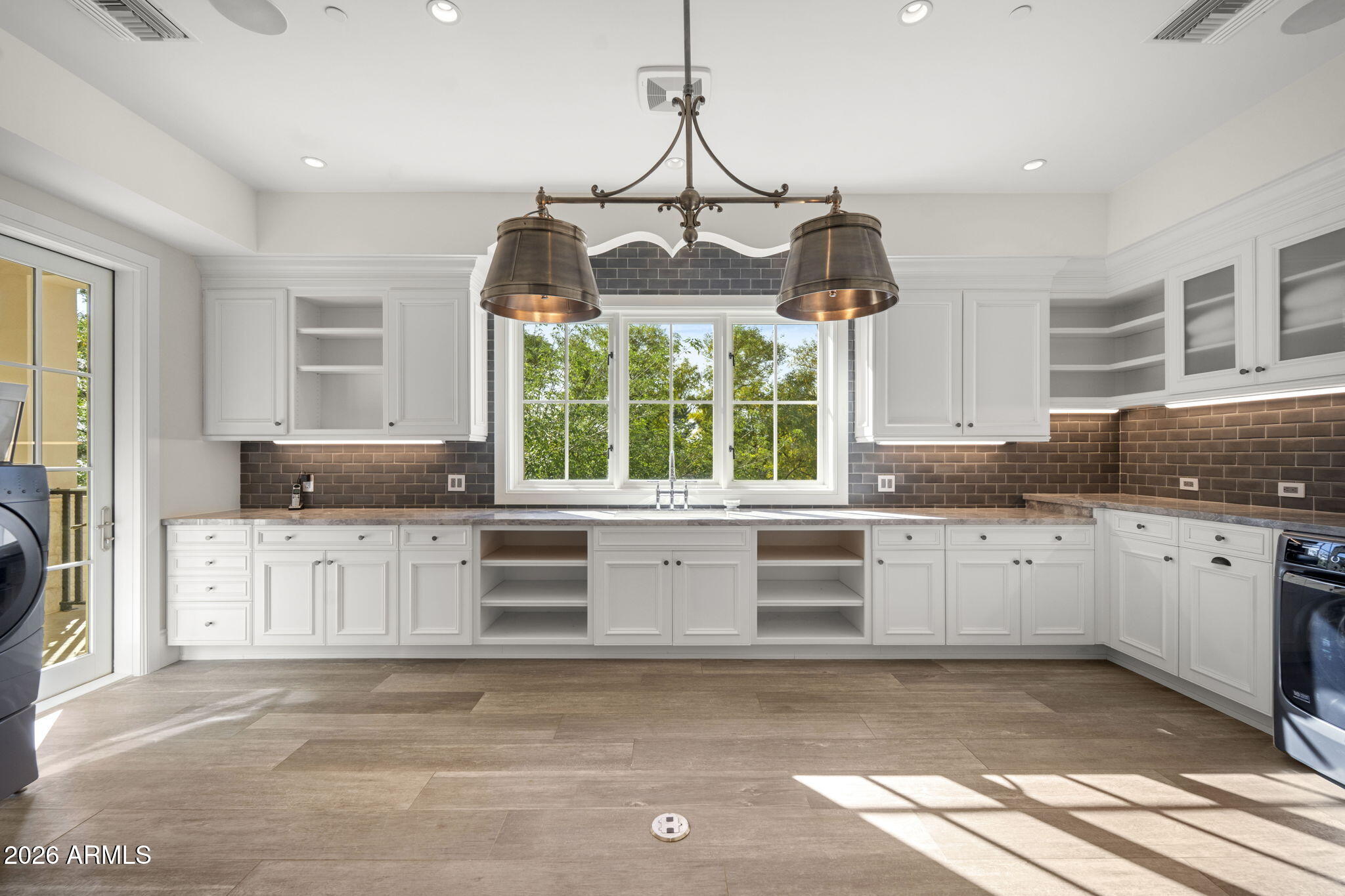 5402 East Exeter Boulevard Phoenix, AZ 85018 - Photo 87 of 110 a kitchen with stainless steel appliances granite countertop a stove a sink and a granite counter tops