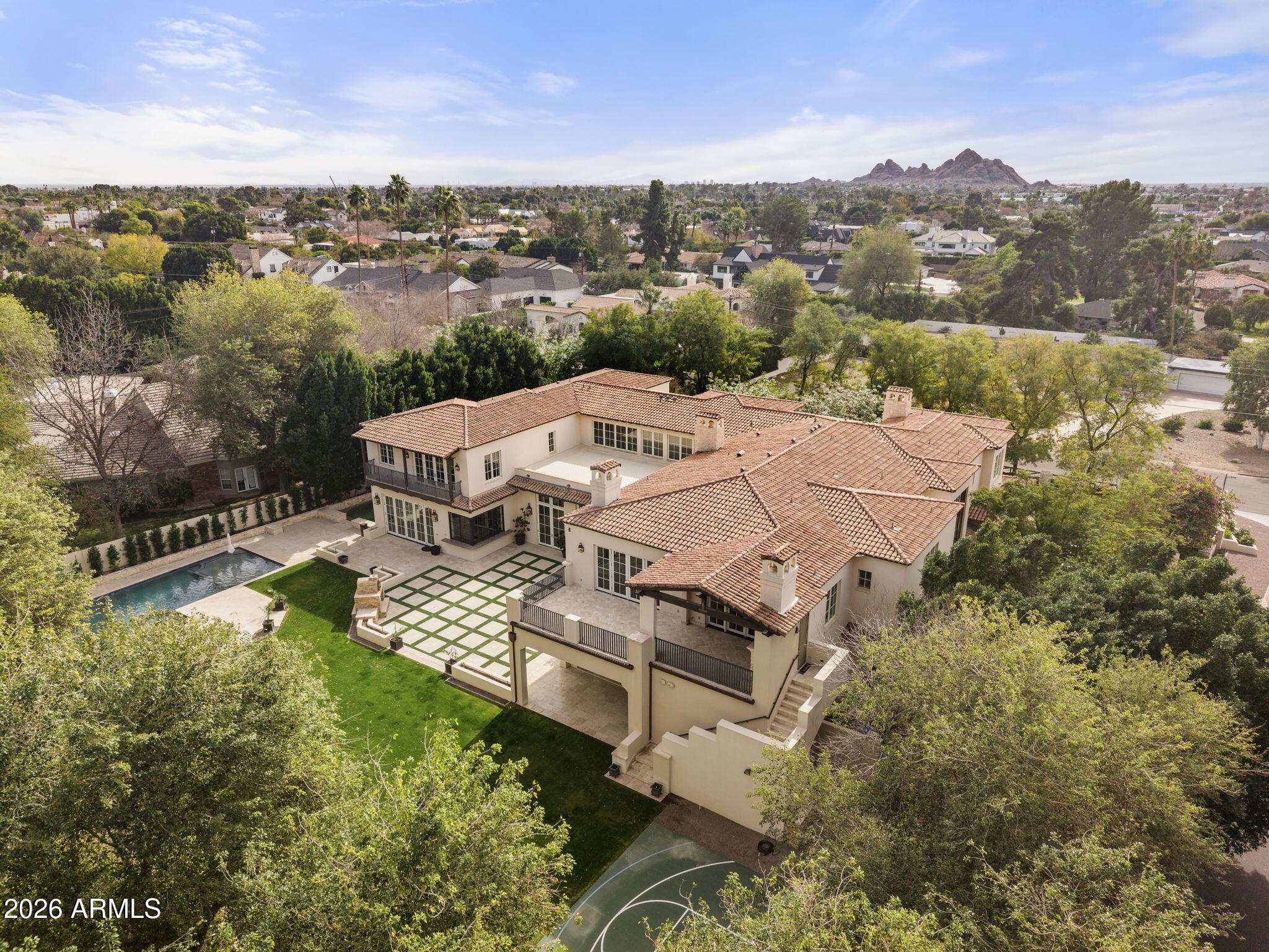 5402 East Exeter Boulevard Phoenix, AZ 85018 - Photo 97 of 110 an aerial view of a house with a garden and lake view