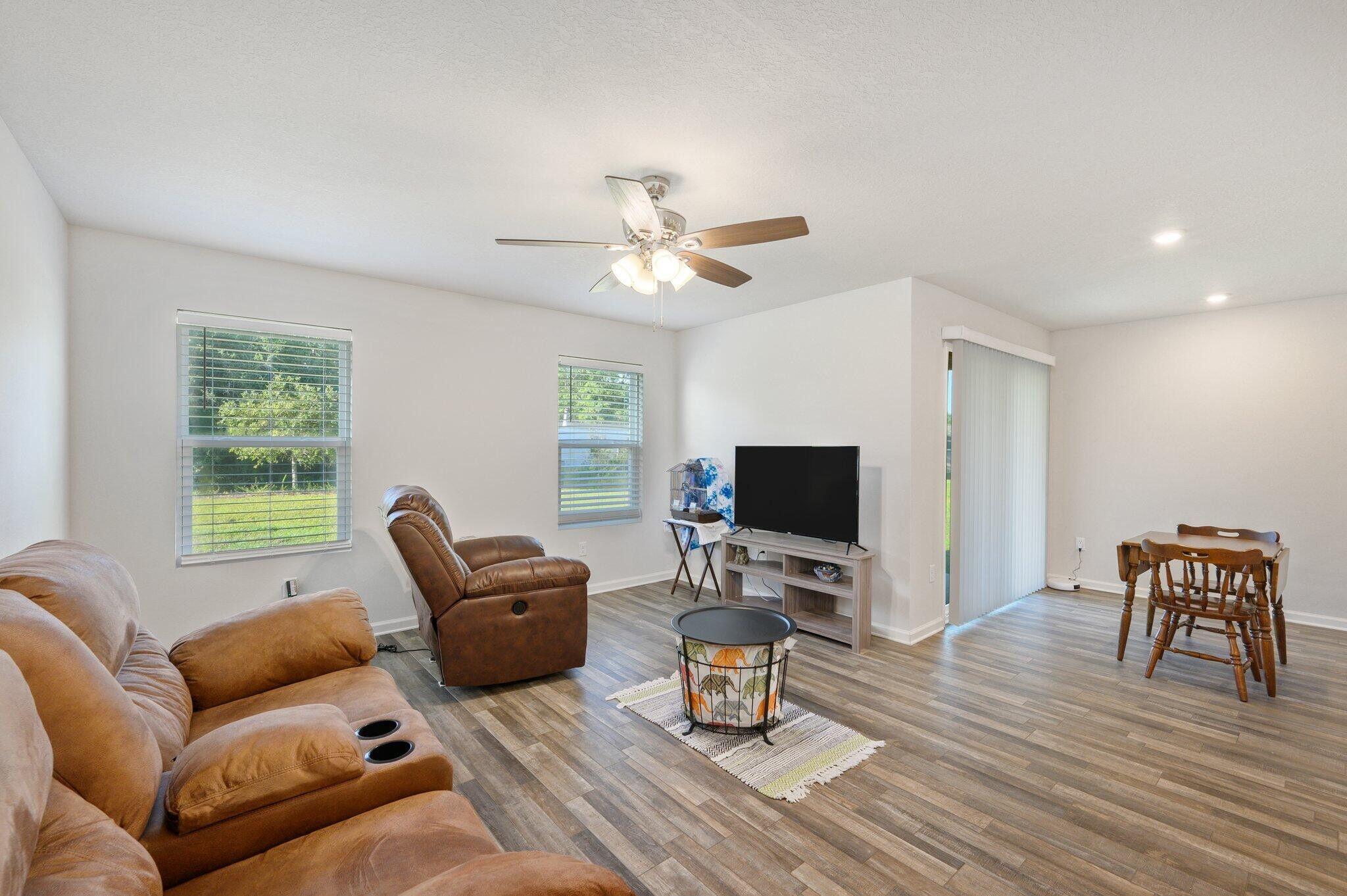 42 Lockwood Way East DeFuniak Springs, FL 32435 - Photo 12 of 39 a living room with furniture and a flat screen tv