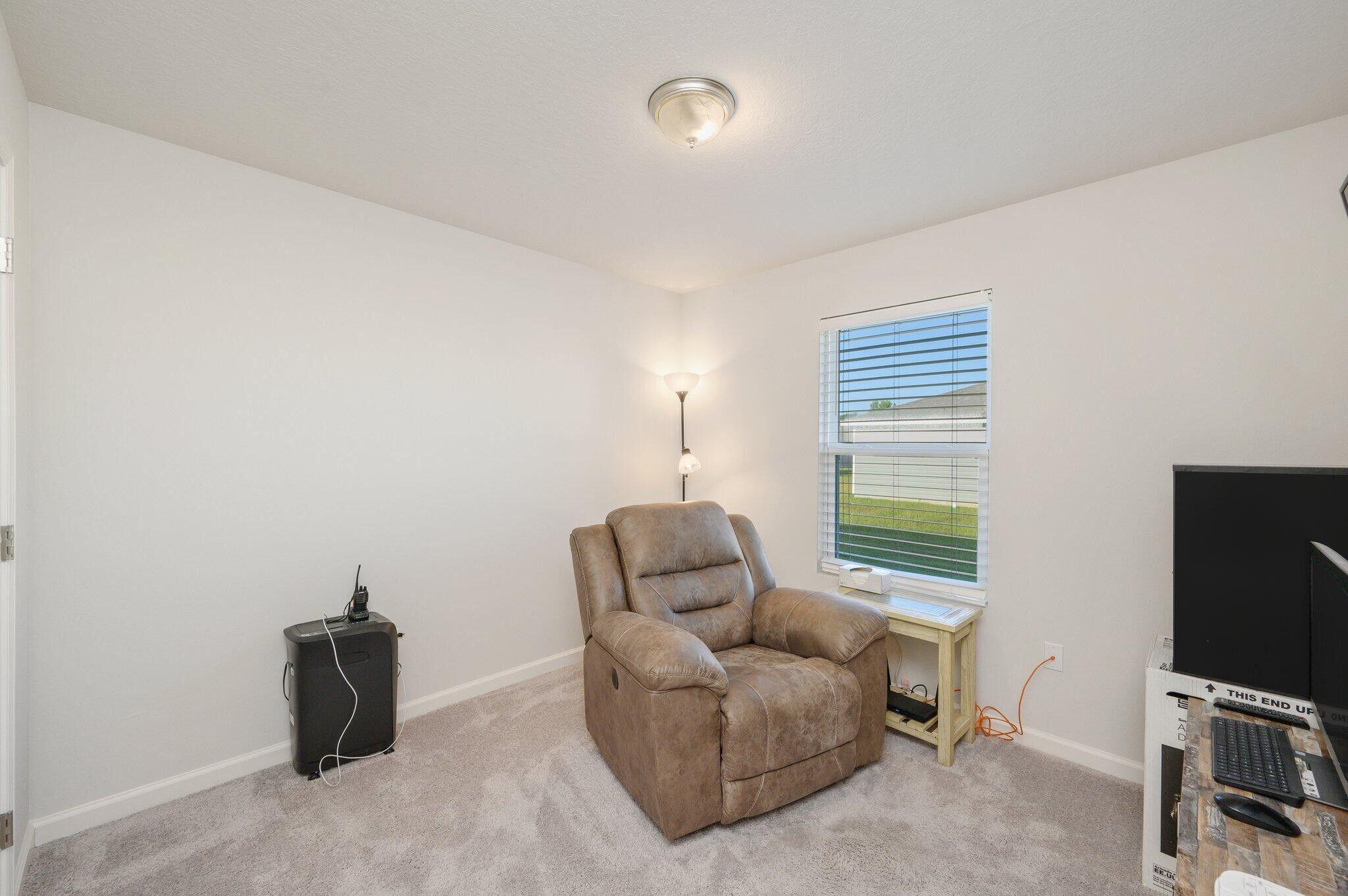 42 Lockwood Way East DeFuniak Springs, FL 32435 - Photo 18 of 39 a living room with furniture and a flat screen tv