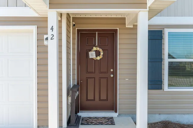 a front view of a house with a door