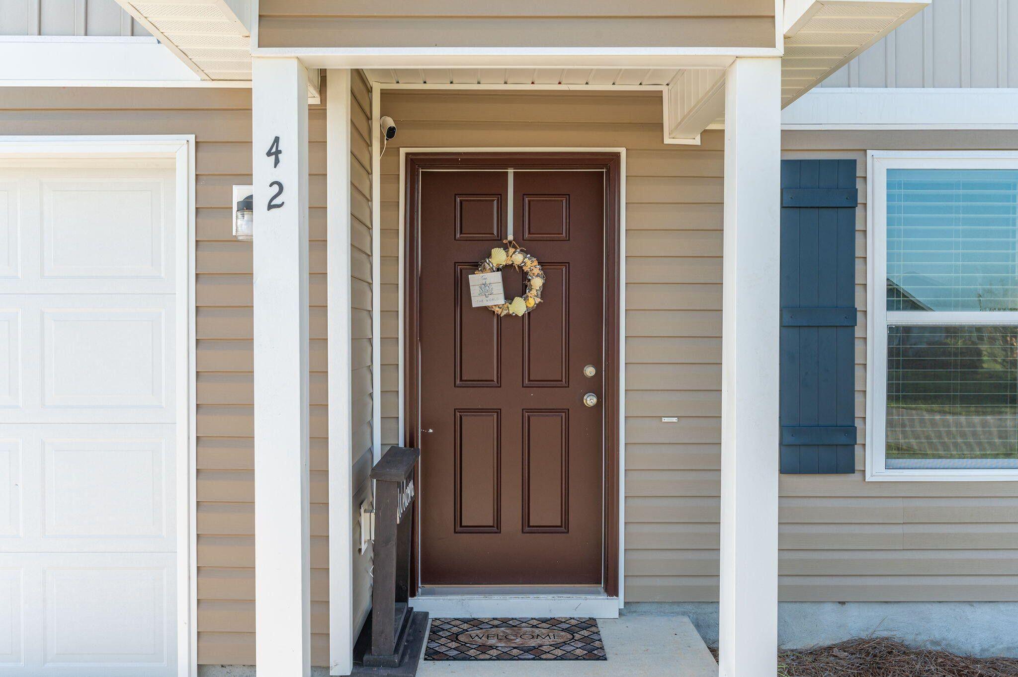 42 Lockwood Way East DeFuniak Springs, FL 32435 - Photo 3 of 39 a front view of a house with a door