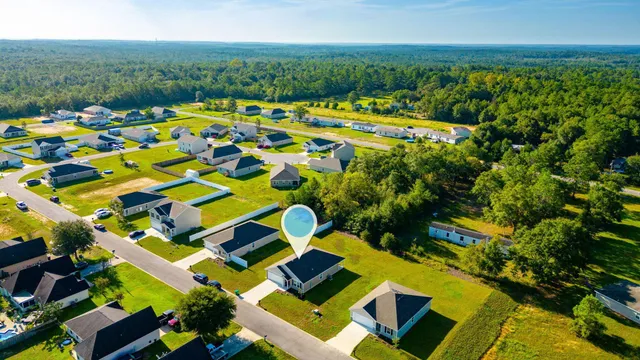 a view of yard with swimming pool outdoor seating and trees