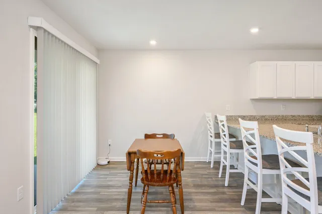 a view of a workspace with wooden floor