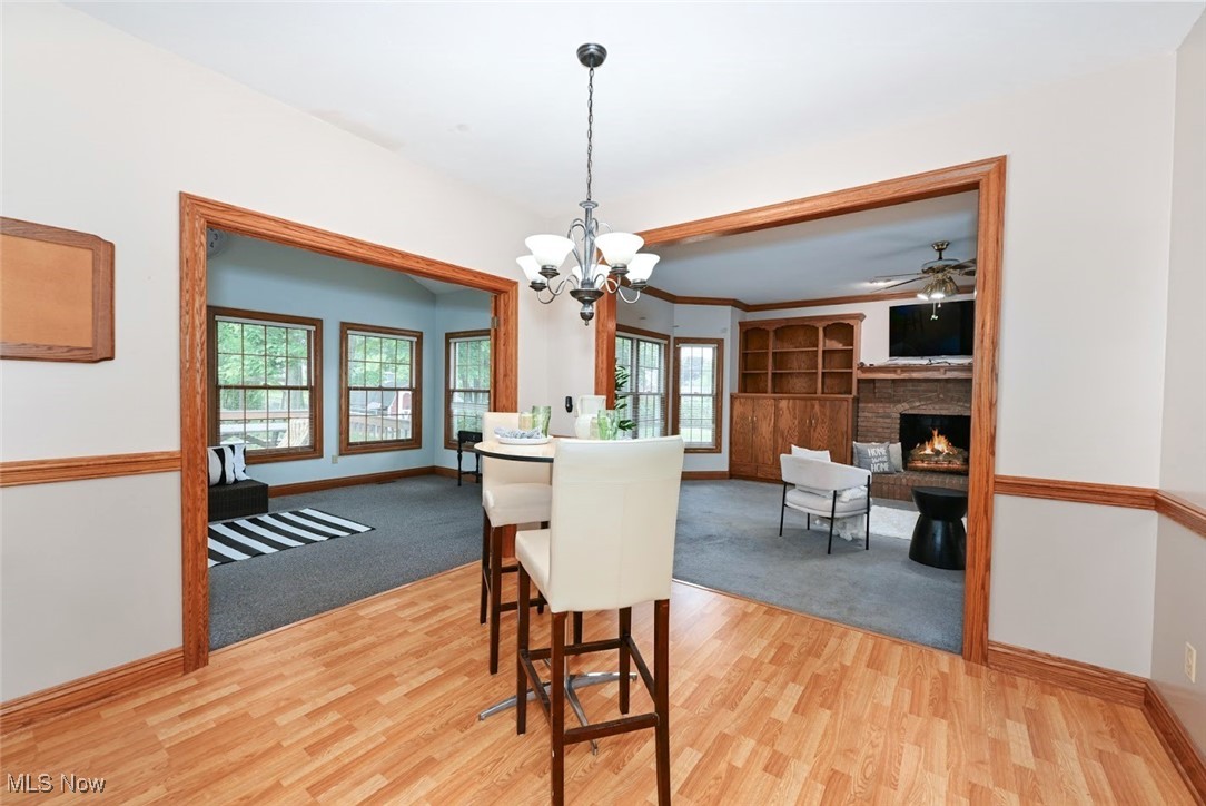 452 Herbert Road Akron, OH 44312 - Photo 12 of 48 *DINING AREA EAT IN KITCHEN CAN W/CHANDELIER NEAR THE SUNROOM ~