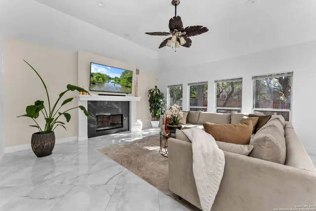 a living room with furniture and a window