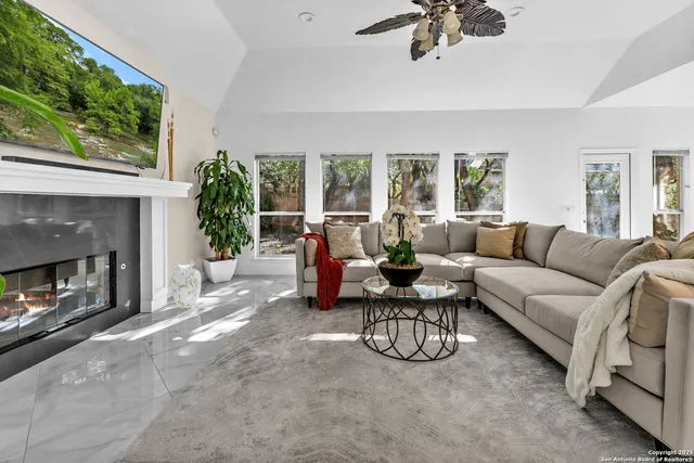 a living room with furniture and a fireplace